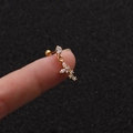 Macro detail of gold-plated starfish stud with cubic zirconia held on a fingertip - Gold Butterfly Style (Gold 5#)
