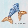 Detail of sky blue resin mermaid tails with gold glitter finish and scale textures - Sky Blue and Gold
