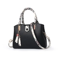 Black PU leather handbag with plaid straps and heart charm in a front-facing studio view - Black