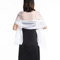 Detail view of lightweight white sheer bridal shawl on model with elegant drape - White