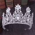 Close-up of silver princess crown with crystals and rhinestones on vintage wood surface - Thick Silver White Rhinestone