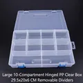 Detail view of 10-compartment clear plastic jewelry box with blue latches and handle - Large 10-Grid Flip Lid Clear Box