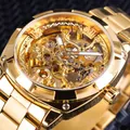 Detailed close-up of golden skeleton mechanical watch movement and metal strap - Gold