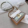 Elegant multi-color patchwork square bag with gold circular handle and chain strap - White