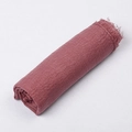 Elegantly rolled wine red crinkle cotton scarf featuring unique frayed edges and texture - Dust Rose