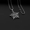 Macro shot of silver pentagram skull pendant with engraved symbols on box chain - Pentagram Skull + Stainless Steel Chain