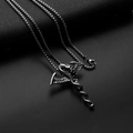 Detailed view of a silver and black dragon snake cross pendant on dark leather background - Dragon Cross + Stainless Steel Chain
