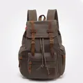 Vintage dark grey canvas backpack with brown leather straps and multiple exterior pockets - Army Green
