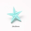 Detailed view of light blue resin starfish charm with white dot texture and 29x30mm dimensions - Blue Thin Starfish