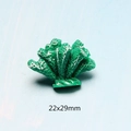 Macro shot of 22x29mm green resin coral charm with white spots for DIY crafting - Green Coral