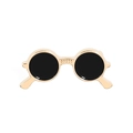 Detail of round sunglasses brooch with gold alloy frame and black enamel finish - Red Lens Gold Frame