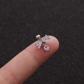 Macro view of bow knot stud earring with sparkling cubic zirconia on a fingertip - Silver Bowknot Pendant Style (Silver 5#)