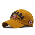 Close-up of the CANADA letter embroidery and maple leaf on yellow cotton baseball cap - Adjustable / Cotton Yellow