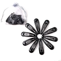 Macro view of black metal snap hair clips arranged in a circle with a white mesh bag - Black (10 Pieces)