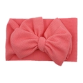 Elastic baby headband in coral pink waffle texture fabric with a large decorative bow - Deep Watermelon Red