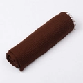 Deep brown bali yarn scarf with crinkle texture and fringe trim rolled neatly - Coffee