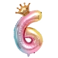 Close-up of a gradient rainbow foil number 6 balloon with a golden crown topper - Number 6 With Crown