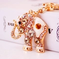 Golden elephant keychain with sparkling champagne rhinestones and white enamel accents - Coffee Gemstone Elephant