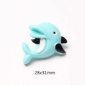Detail view of 28x31mm light blue resin dolphin charm for DIY phone cases and crafts - Blue Dolphin