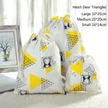 Three sizes of cotton linen drawstring storage bags with yellow triangle and deer print - Heart Deer Grid