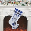 Calza di Natale a zampa di cane con quadri blu e cornice foto su camino festivo - Quadri Blu
