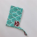 Close-up of raccoon pattern fabric bag with sturdy stitching and teal cotton handle - Blue Jungle Bear