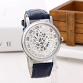 Detailed side view of silver quartz watch with skeleton dial and blue leather strap - Silver Face Blue Strap