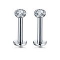 Macro shot of polished stainless steel labret stud with sparkling zircon and flat back disk - Round White Zirconia / Steel