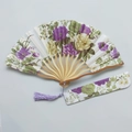 Japanese folding fan with purple and yellow floral patterns and matching fabric pouch - No. 8 Bright Purple