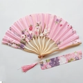 Pink Japanese folding fan with cherry blossom pattern, bamboo frame and tassel - Pink