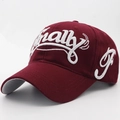 Burgundy cotton baseball cap with white 3D embroidered Finally letters in a side view - Burgundy
