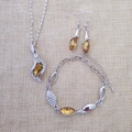 Detailed set of silver necklace, earrings, and bracelet with amber marquise crystals - Silver & Yellow