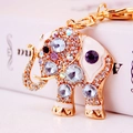 Golden elephant keychain with white enamel and colorful crystals for bags - Purple Gemstone Elephant