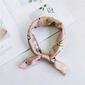 Silk square scarf in pink with gold chain pattern tied in a decorative knot - Gem Chain Khaki