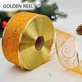 Sparkling orange sheer ribbon with gold glitter spirals and metallic edges for gifting - 6.3cm Orange
