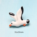 Detail view of a 31x33mm resin seagull figurine with orange beak for DIY crafts - Black Seagull