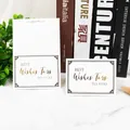 Elegant white greeting card with gold foil lettering and decorative black border - 10 Best Wishes To You