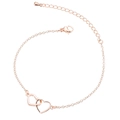 Close-up of rose gold double interlocking hearts bracelet with adjustable lobster clasp - Rose Gold