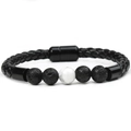 Detailed macro view of men's braided leather bracelet with lava beads and magnetic clasp - Lava Stone + Howlite