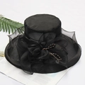 Elegant black organza sun hat with large bow and bead details on a white magazine background - Adjustable / Solid Black