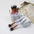Marble pattern makeup brush set with rose gold ferrules in matching cylindrical holder - White In Storage Tube