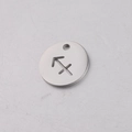 Detailed macro view of a 12mm stainless steel Sagittarius zodiac cutout charm pendant - Sagittarius
