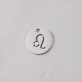 Macro shot of silver mirror-polished 12mm stainless steel Leo zodiac pendant charm - Leo / With Hanging Ring / Gold