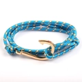 Detail of blue nautical rope bracelet featuring a golden fish hook metal clasp - Blue-Gold Fishhook
