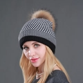 Winter knitted beanie with black and white plaid pattern and a large brown faux fur pom - Black + Natural Pom Pom