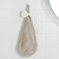 Absorbent coral fleece hand towel in khaki with a white decorative bow and hanging loop - Camel
