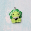 Detail of a green resin frog pendant with leaf hat and bow for DIY accessories - Frog with Screw Eye Pin