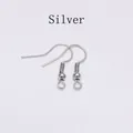 Close-up of silver-plated stainless steel fish hook earrings with coil and loop - White K/Silver
