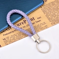 Braided faux leather keychain in lilac purple with polished silver metal ring - Purple