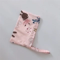 Close-up of pink cotton fabric phone pouch featuring cute cartoon rabbit prints and handle - Pink Bow Rabbit